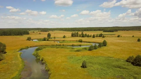 Drone flying forward over meandering river. Aerial shot of beautiful European Video stock 86171475