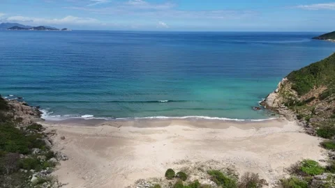 Drone flying forward over Ninh Van Bay wild beach toward open sea 스톡 동영상 336974480