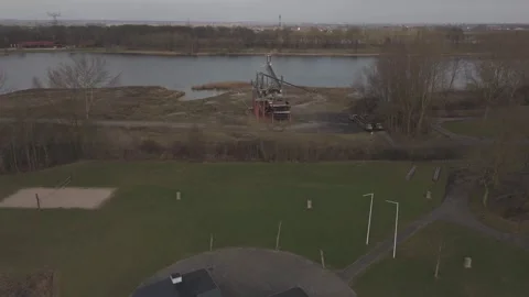 Drone flying forward over an old miner towards highway Stock Footage 330189882