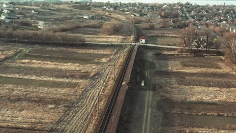 Drone flying forward over railway track while beautiful sunset. Suburban railway Stock-Footage 241012789