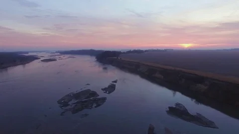 Drone Flying Forward Over River Ascending To Sunrise Stock Footage 78870571