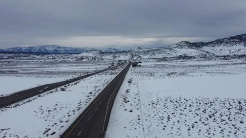 Drone Flying Forward Over Snowy Road Near Mammoth Lakes Stockbeeldmateriaal 335736360