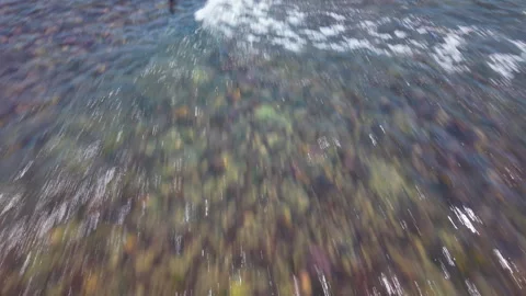 Drone Flying Forward Over Water, Panning Up to Reveal Beacon, Coastline, Green L Stock Footage 306316128