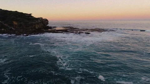 Drone flying forward over waves and rocks Stock Footage 121859636