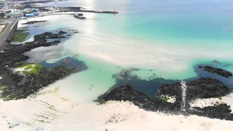 Drone flying forwards over beach, sand bank and turquoise sea in Asia Stock Footage 91092311