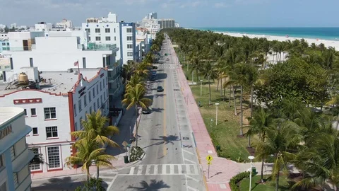 Drone Flying Forwards Over Ocean Drive During Coronavirus Lockdown Stock Footage 127064926