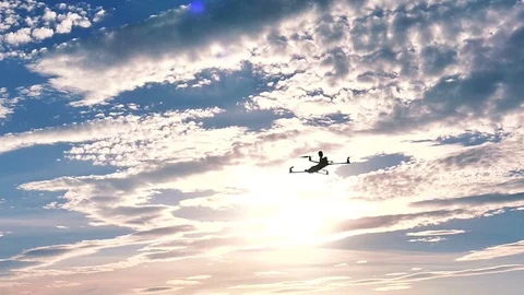 Drone flying in  front of  blue sky  with clouds. Slow motion Stock-Footage 77142642