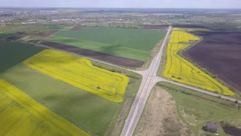 Drone flying high over a prairie landscape of blooming fields with a restored Stock Footage 143708635