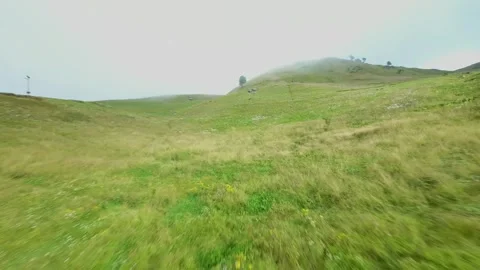 Drone flying high speed upwards a mountain Video stock 252071881