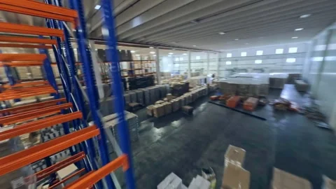 Drone Flying Inside The Rack Of Goods Stored Inside The Warehouse. - 库存影片 240921752
