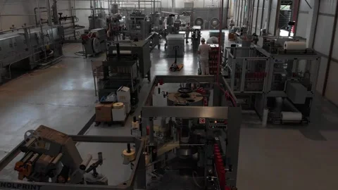 Drone flying inside a sauce production facility Stock Footage 304973134