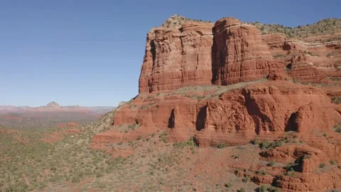 A drone flying to the left with Courthouse Butte and Bell Rock Stock Footage 131328502