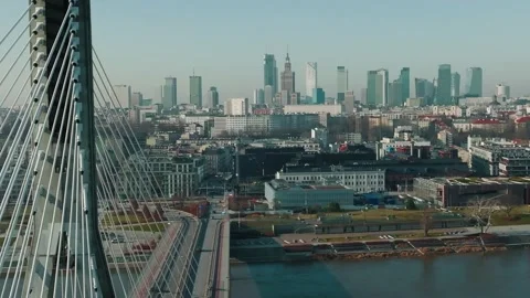 Drone flying left by modern cable bridge over Wisla river revealing beautiful Video stock 172071576