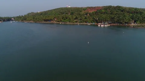 Drone flying to the lighthouse on summit of hill. Aerial view. Stock Footage 84877240