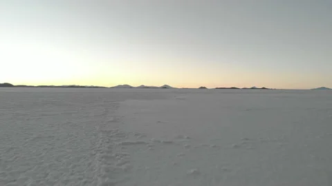 Drone flying low above the ground in Salar de Uyuni salt flat, Andes, Bolivia Stock Footage 175914670