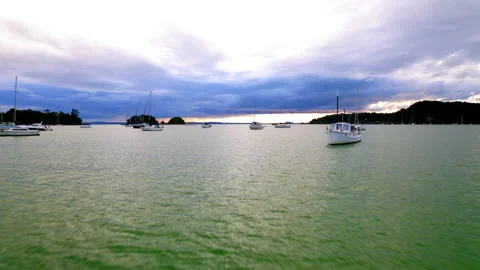 Drone Flying Low And Fast Above Water Towards Boats Mooring In Waiheke Islan Stock Footage 234949637