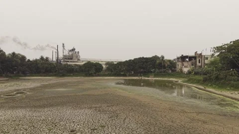 Drone Flying Low Over Cracked Dry Lake Bed During Drought in Bangladesh Stock Footage 337981729