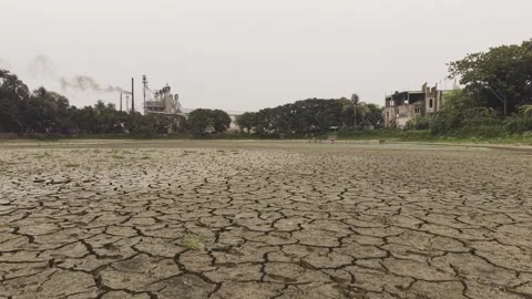 Drone Flying Low Over Cracked Dry Lake Bed During Drought in Bangladesh Stock Footage 337981754
