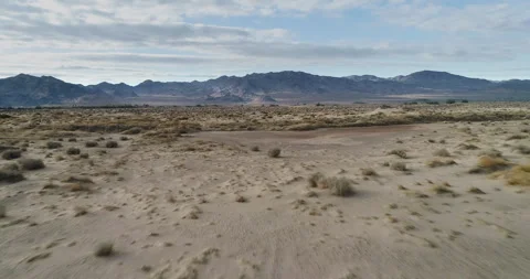 Drone flying low over desert scrub . Stock Footage 286367497