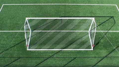 Drone flying low over an empty artificial turf soccer field Video stock 311060289