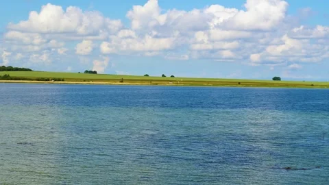 Drone flying low over lake and countryside Stock Footage 242595249