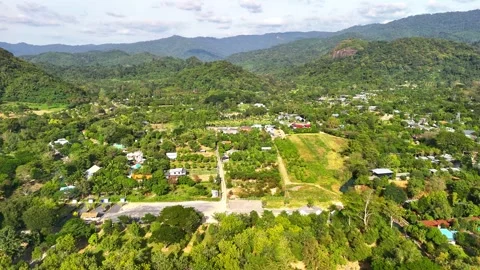 Drone flying low over a peaceful Thai countryside. Stock Footage 331028624
