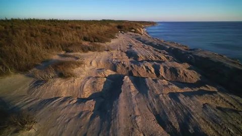Drone flying low over rocky shores of the Danish island Bornholm Stock Footage 314213404
