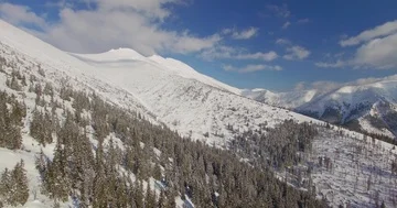 Drone flying in mountains during snow winter. Nice sunny day, amazing mountains. Stock Footage 85882730