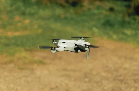 Drone flying mountains with propellers in motion Stock Photos