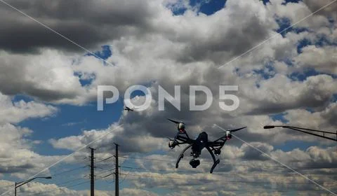 Drone flying near commercial airplane, danger of collision. Stock Photos