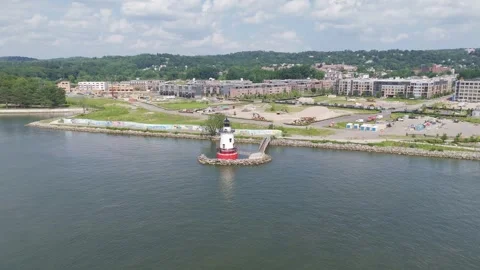 Drone Flying Near Lighthouse and Waterfront Mural on a Sunny Day Stock Footage 314873269