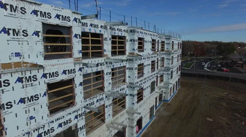 Drone flying next to a building under construction Stock Footage 64145534