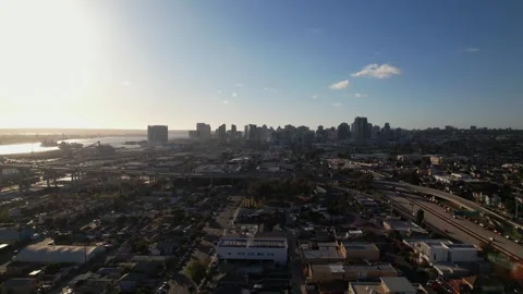 Drone flying north toward downtown San Diego at 6PM capturing a wide view of Stock Footage 333717222