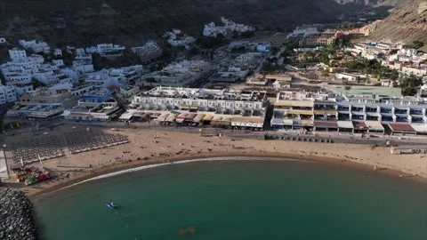 Drone Flying Out from Playa de Mogán – Gran Canaria Beach and Harbor View Stock Footage 309951093