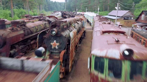 Drone flying over abandoned Soviet trains. Summer day. The Gulf of Finland Stock Footage 168473551