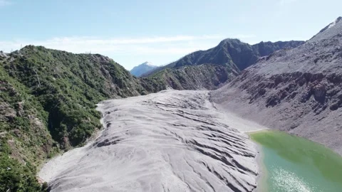 Drone flying over the accumulation of ash from the top of the Chaitén volcano. Stock Footage 249011641