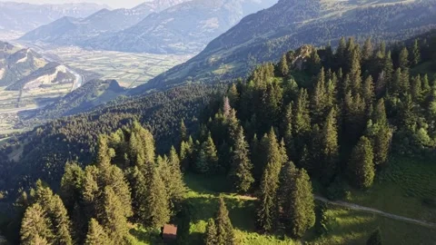 Drone flying over alpine mountain landscape with forest and hiking trail Stock Footage 339645337