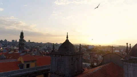 Drone flying over ancient cathedral in Porto at sunrise Stock Footage 107721837
