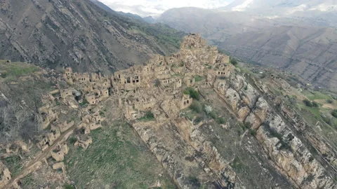 Drone flying over ancient ghost town Gamsutl in Caucasus mountains, Dagestan Stock-Footage 196159805