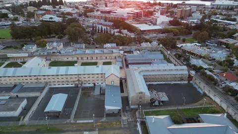 Drone Flying Over Australia Prison in Fremantle Perth City Seascape Sunset Stock Footage 247630543