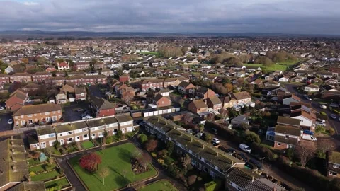 Drone flying over average UK town residential housing Stock Footage 328125667