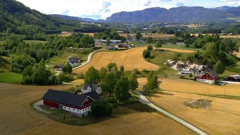 Drone flying over beautiful fields and farms in Norway, drone stock footage b Video stock 127589583