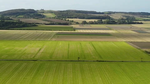 Drone flying over big fields in Denmark, drone stock footage by DroneRune Stock Footage 138688405