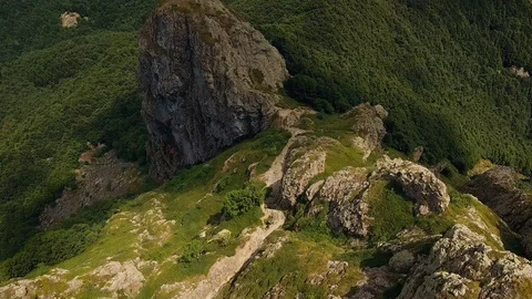Drone flying over big rock in the mountain  Stock Footage 112174813