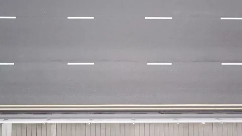 Drone flying over bridge with close-up cars driving by (Singapore) Stock Footage 329052008