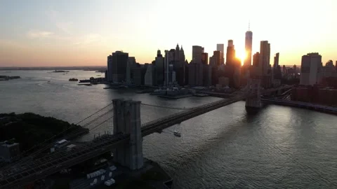 Drone Flying over Brooklyn Bridge towards Manhattan, New York at Sunset Stock Footage 243300350