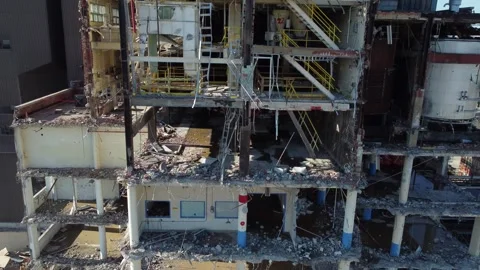 Drone flying over building being demolished with walls broken down in city 스톡 동영상 284849626