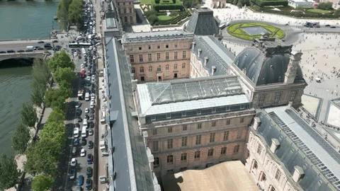 Drone flying over building courtyard of Louvre museum, Paris. Aerial tilt Stock Footage 218113867