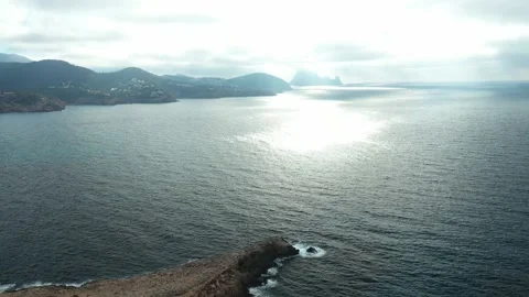 Drone flying over Cala Tarida in the direction of Es Vedra. Ibiza. Stock Footage 169042341
