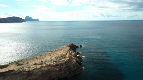Drone flying over Cala Tarida in the direction of Es Vedra. Ibiza. Stock Footage 169042401